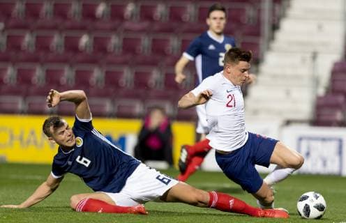 16th October 2018, Tynecastle Park, Edinburgh, Scotland; UEFA U21 U 21 European Football Championships, qualification, Scotland versus England; Ryan Porteous of Scotland slides in to tackle Harvey Barnes of England  ActionPlus12070470 AlanxRennie