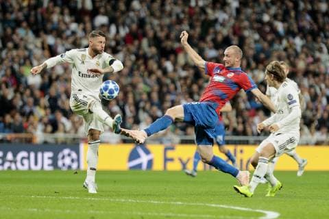 Real Madrid s Sergio Ramos (L) and Luka Modric (R) and FC Viktoria Plzen s Michael Krmencik during UEFA Champions League match between Real Madrid and FC Viktoria Plzen at Santiago Bernabeu Stadium in Madrid, Spain. October 23, 2018.  (20181023011)