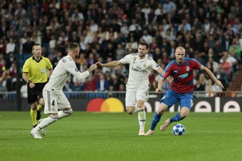 Real Madrid s Sergio Ramos (L) and Nacho Fernandez (R) and FC Viktoria Plzen s Michael Krmencik during UEFA Champions League match between Real Madrid and FC Viktoria Plzen at Santiago Bernabeu Stadium in Madrid, Spain. October 23, 2018.  (20181023006)