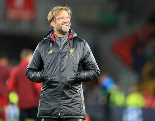 24th October 2018, Anfield, Liverpool, England; UEFA Champions League football, Liverpool versus Red Star Belgrade; Liverpool manager Jurgen Klopp reacts with a smile to fans in the main stand  ActionPlus12072934 DavidxBlunsden
