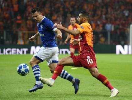 Younes Belhanda of Galatasaray and Yevhen Konoplyanka of FC Schalke 04 during the UEFA Champions League Group D match between Galatasaray and FC Schalke 04 at Turk Telekom Stadium in Istanbul , Turkey on October 24 , 2018. 