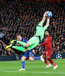 24th October 2018, Anfield, Liverpool, England; UEFA Champions League football, Liverpool versus Red Star Belgrade; Red Star Belgrade goalkeeper Milan Borjan claims a cross as Mohamed Salah of Liverpool challenges  ActionPlus12073009 DavidxBlunsden