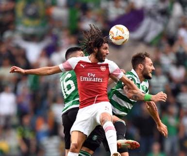 (181026) -- LISBON, Oct. 26, 2018 (Xinhua) -- Rodrigo Battaglia (L) of Sporting vies with Mohamed Elneny (C) of Arsenal during the Europa League Group E third round soccer match between Sporting CP and Arsenal FC at Jose Alvalade Stadium in Lisbon, Portugal, on Oct. 25, 2018. Arsenal won 1-0. (Xinhua Zhang Liyun) (SP)PORTUGAL-LISBON-SOCCER-EUROPA LEAGUE-SPORTING VS ARSENAL 