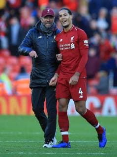 27th October 2018, Anfield, Liverpool, England; EPL Premier League football, Liverpool versus Cardiff City; Liverpool manager Jurgen Klopp shares a joke with his captain Virgil van Dijk at the final whistle  ActionPlus12073967 DavidxBlunsden