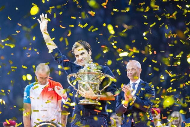 28th October 2018, St Jakobshalle, Basel, Switzerland; ATP Tennis Herren World Tour, Swiss Indoor Tennis; Roger Federer receives his winners trophy after the singles final watched on by runner-up Marius Copil (ROU), and tournament managing director Patrick Ammann  ActionPlus12074668 DavidxEmm