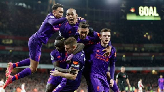 Football - 2018 2019 Premier League - Arsenal vs. Liverpool Liverpool players congratulate goal scorer James Milner (Liverpool FC) as they celebrate in front of their fans at The Emirates. COLORSPORT DANIEL BEARHAM  csp_ars_liv_031118_
