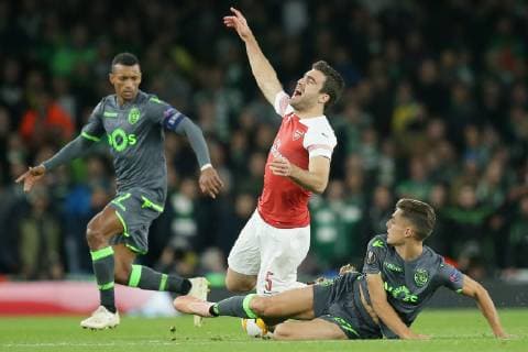 (181109) -- LONDON, Nov. 9, 2018 (Xinhua) -- Sporting Lisbon s Miguel Luis (R) fouls Arsenal s Sokratis Papastathopoulos (C) during the UEFA Europa League group E match between Arsenal and Sporting Lisbon at the Emirates Stadium in London, Britain on Nov. 8, 2018. The final score was 0-0. (Xinhua Tim Ireland) FOR EDITORIAL USE ONLY. NOT FOR SALE FOR MARKETING OR ADVERTISING CAMPAIGNS. NO USE WITH UNAUTHORIZED AUDIO, VIDEO, DATA, FIXTURE LISTS, CLUB LEAGUE LOGOS OR LIVE SERVICES. ONLINE IN-MATCH USE LIMITED TO 45 IMAGES, NO VIDEO EMULATION. NO USE IN BETTING, GAMES OR SINGLE CLUB LEAGUE PLAYER PUBLICATIONS. (SP) BRITAIN-LONDON-FOOTBALL-EUROPA LEAGUE-ARSENAL VS SPORTING LISBON