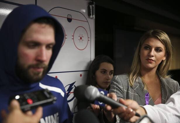 November 6, 2018 - Tampa, Florida, U.S. - DIRK SHADD Times .Caley Chelios (right), Tampa Bay Lightning Hockey Reporter and Analyst Fox Sports Florida Correspondent for the Tampa Bay Lightning, works to interview Lightning right wing Nikita Kucherov (86) (left) in the locker room after a victory over the Edmonton Oilers at Amalie Arena in Tampa Tuesday evening (11 07 18) Florida News - November 6, 2018 - ZUMAs70_ 86646805st Copyright: xDirkxShaddx