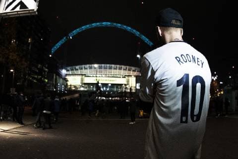 15th November 2018, Wembley Stadium, London, England; Wayne Rooney Foundation International football friendly, England versus United States of America; A fan with Rooney printed on his back walks up Wembley way  ActionPlus12079594 ShaunxBrooks