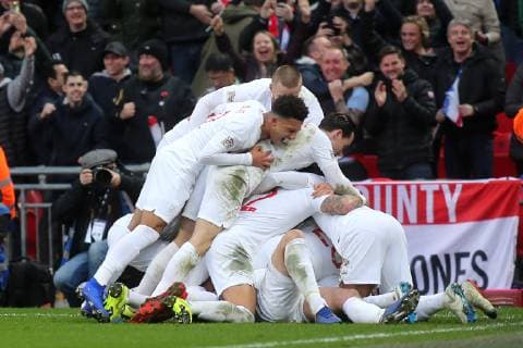 England players leap onto Harry Kane to celebrate their second goal during the Nations League A Group 4 international match L?nderspiel between England and Croatia at Wembley Stadium, London, England on 18 November 2018. Copyright: xPaulxDennisx PMI-2412-0024