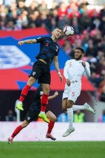 Ivan Perisic of Croatia wins a header under pressure from Joe Gomez of England during the UEFA Nations League match at Wembley Stadium, London. Picture date: 18th November 2018. Picture credit should read: Craig Mercer Sportimage EDITORIAL USE ONLY. No use with unauthorised audio, video, data, fixture lists, club league logos or live services. Online in-match use limited to 120 images, no video emulation. No use in betting, games or single club league player publications. C77R5894.CR2