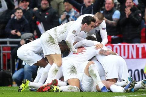 England players leap onto Harry Kane to celebrate their second goal during the Nations League A Group 4 international match L?nderspiel between England and Croatia at Wembley Stadium, London, England on 18 November 2018. Copyright: xPaulxDennisx PMI-2412-0067