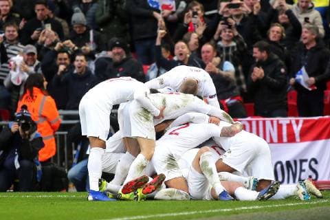 England players leap onto Harry Kane to celebrate their second goal during the Nations League A Group 4 international match L?nderspiel between England and Croatia at Wembley Stadium, London, England on 18 November 2018. Copyright: xPaulxDennisx PMI-2412-0068