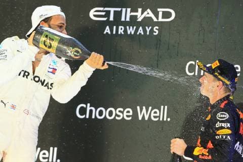 25th November 2018, Yas Marina, Abu Dhabi, United Arab Emirates; Etihad Airways Formula 1 Grand Prix of Abu Dhabi, race day; Mercedes AMG Petronas Motorsport, Lewis Hamilton wins the race and sprays champagne in 3rd placed Max Verstappen  ActionPlus12083009 Octane