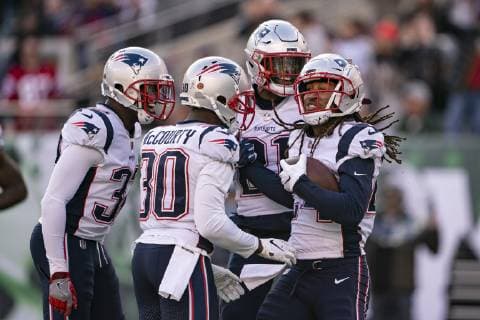 EAST RUTHERFORD, NJ - NOVEMBER 25: New England Patriots Cornerback Jason McCourty (30) and New England Patriots Linebacker Duron Harmon (21) congratulate New England Patriots Cornerback Stephon Gilmore (24) after getting an interception during the second quarter of the New England Patriots versus the New York Jets on November 25, 2018, at MetLife Stadium in East Rutherford, NJ. (Photo by Gregory Fisher Icon Sportswire) NFL American Football Herren USA NOV 25 Patriots at Jets Icon181125015 EDITORIAL USE ONLY