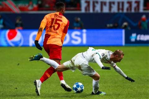 MOSCOW, RUSSIA â€“ NOVEMBER 28, 2018: Galatasaray Istanbulâ€™s Ryan Donk (L) and Lokomotiv Moscowâ€™s Vladislav Ignatyev in their 2018 19 UEFA Champions League Group D Round 5 football match at RZD Arena; Lokomotiv Moscow won 2-0. Sergei Fadeichev TASS  TS099286