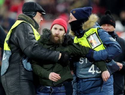 MOSCOW, RUSSIA - NOVEMBER 29, 2018: Security guards detain a pitch invader during the 2018 19 UEFA Europa League Group G Round 5 football match between Spartak Moscow and Rapid Vienna at Otkrytie Arena. Sergei Bobylev TASS  TS099477