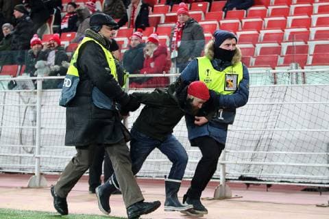 MOSCOW, RUSSIA - NOVEMBER 29, 2018: Security guards detain a pitch invader during the 2018 19 UEFA Europa League Group G Round 5 football match between Spartak Moscow and Rapid Vienna at Otkrytie Arena. Sergei Bobylev TASS  TS09947A