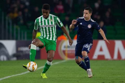 29th November 2018, Estadio Benito Villamarin, Seville, Spain; UEFA Europa League football, Real Betis versus Olympiakos; Junior of Real Betis passes the ball under pressure from Daniel Podence of Olympiacos  ActionPlus12083903 AntonioxGomez