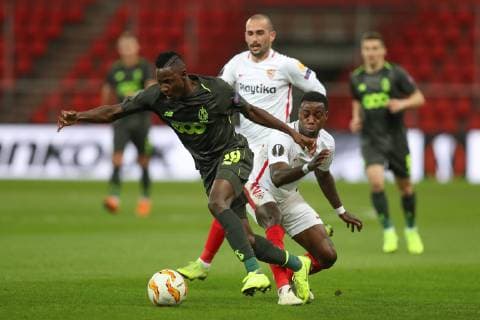 Standard s Moussa Djenepo and Sevilla s forward Quincy Promes fight for the ball during the match between Belgian soccer team Standard de Liege and Spanish club Sevilla, in Liege, Thursday 29 November 2018 on the fifth day of the UEFA Europa League group stage, in group J. BRUNOxFAHY  x05479536x
