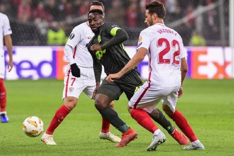 Standard s Paul-Jose Mpoku M Poku Ebunge and Sevilla s midfielder Franco Vazquez fight for the ball during the match between Belgian soccer team Standard de Liege and Spanish club Sevilla, in Liege, Thursday 29 November 2018 on the fifth day of the UEFA Europa League group stage, in group J. LAURIExDIEFFEMBACQ  x05479570x
