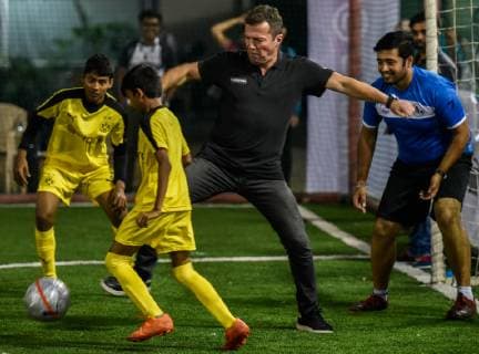 MUMBAI, INDIA DECEMBER 5: Former German football captain Lothar Matthaus plays with children during a football clinic organised by Indo German chambers and Bundesliga at Cooperage Ground, Nariman Point, on December 5, 2018 in Mumbai, India. (Photo by Kunal Patil Hindustan Times ) Former German football captain Lothar Matthaus In India