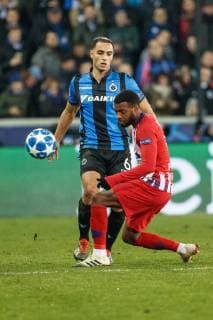 Club s Sofyan Amrabat and Atletico s Thomas Lemar fight for the ball during a game between Belgian soccer team Club Brugge KV and Spanish club Athletico Madrid, in Brugge, Tuesday 11 December 2018, on the sixth and last day of the UEFA Champions League, in the group A. KURTxDESPLENTER  x05488095x