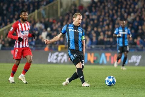 Atletico s Thomas Lemar and Club s Ruud Vormer fight for the ball during a game between Belgian soccer team Club Brugge KV and Spanish club Athletico Madrid, in Brugge, Tuesday 11 December 2018, on the sixth and last day of the UEFA Champions League, in the group A. KURTxDESPLENTER  x05488113x