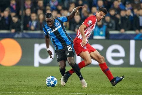 Club s Marvelous Nakamba and Atletico s Rodrigo Hernandez Cascante fight for the ball during a game between Belgian soccer team Club Brugge KV and Spanish club Athletico Madrid, in Brugge, Tuesday 11 December 2018, on the sixth and last day of the UEFA Champions League, in the group A. KURTxDESPLENTER  x05488201x