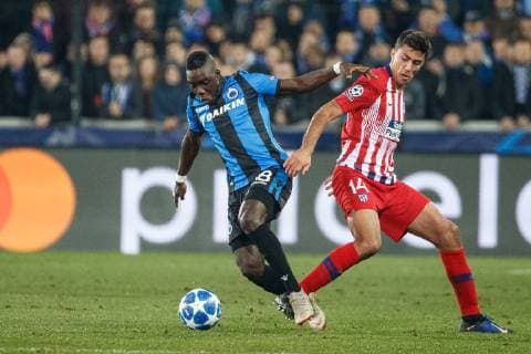 Club s Marvelous Nakamba and Atletico s Rodrigo Hernandez Cascante fight for the ball during a game between Belgian soccer team Club Brugge KV and Spanish club Athletico Madrid, in Brugge, Tuesday 11 December 2018, on the sixth and last day of the UEFA Champions League, in the group A. KURTxDESPLENTER  x05488202x