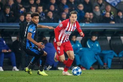 Club s Cyril Ngonge and Atletico s Santiago Arias fight for the ball during a game between Belgian soccer team Club Brugge KV and Spanish club Athletico Madrid, in Brugge, Tuesday 11 December 2018, on the sixth and last day of the UEFA Champions League, in the group A. KURTxDESPLENTER  x05488214x