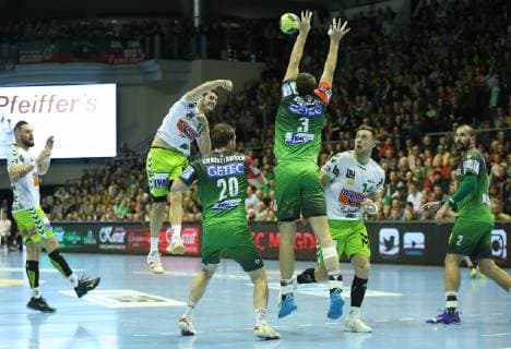 19.12.2018, xcsx, Handball DHB Pokal, SC Magdeburg - Frisch Auf! Goeppingen emspor, v.l. Ivan Sliskovic (Frisch auf! Göppingen) beim Wurf, Piotr Chrapkowski (SC Magdeburg) blockt den Wurf (DFL DFB REGULATIONS PROHIBIT ANY USE OF PHOTOGRAPHS as IMAGE SEQUENCES and or QUASI-VIDEO) Magdeburg