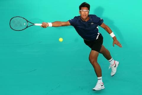 (181228) -- ABU DHABI, Dec. 28, 2018 (Xinhua) -- Hyeon Chung of South Korea returns the ball during his match against Kevin Anderson of South Africa at the 2018 Mubadala World Tennis Championship in Abu Dhabi, the United Arab Emirates (UAE), on Dec. 27, 2018. Hyeon Chung lost 1-2. (Xinhua Mahmoud Khaled) (SP)UAE-ABU DHABI-TENNIS-MUBADALA WORLD TENNIS CHAMPIONSHIP 