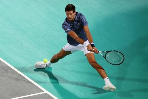 (181229) -- ABU DHABI, Dec. 29, 2018 (Xinhua) -- Novak Djokovic of Serbia returns to Karen Khachanov of Russia during the 2018 Mubadala World Tennis Championship in Abu Dhabi, the United Arab Emirates (UAE), on Dec. 28, 2018. Novak Djokovic won 2-0. (Xinhua Mahmoud Khaled) (SP)UAE-ABU DHABI-TENNIS-MUBADALA WORLD TENNIS CHAMPIONSHIP 