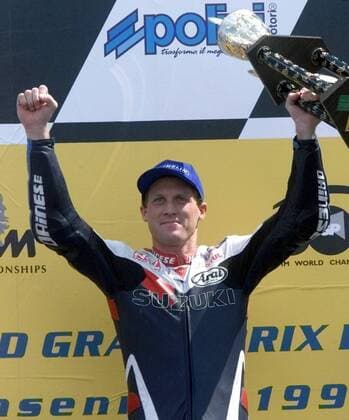 U.S. rider Kenny Roberts junior shows during the winner ceremony his trophy to the crowd. Roberts wons the 500cc race of German motor cycling Grand Prix at the Sachsenring circuit Sunday, July 18, 1999. ( Eckehard Schulz) SACHSENRING DEU