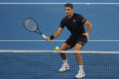 30th December 2018, RAC Arena, Perth, Australia; Hopman Cup Tennis, sponsored by Mastercard; Roger Federer of Team Switzerland volleys at the net during the mixed doubles against Great Britain  ActionPlus12091763 DavidxWoodley