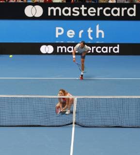 2nd January 2019, RAC Arena, Perth, Australia; Hopman Cup Tennis, sponsored by Mastercard; Alize Cornet of Team France ducks as Lucas Pouille serves during the mixed doubles  ActionPlus12092332 DavidxWoodley
