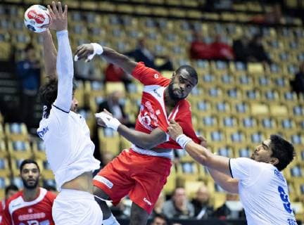 Mosbah Sanai of Tunisia is stopped by Javier Frelijj of Chile during the men s IHF Handball World Championship WM Weltmeisterschaft Group C match between Tunisia and Chile in Herning, Denmark, on Monday, Jan 14, 2019.. , Herning Jylland Copyright: HenningxBagger HenningxBaggerx COP109 spdk20190114-154525-L