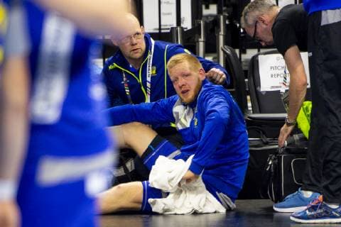 190117 Jim Gottfridsson of Sweden injured by the benches during the IHF World Handball Championship match between Sweden and Hungary on January 17, 2019 in Copenhagen. Photo: Ludvig Thunman BILDBYRN kod LT 35581 Copyright: LUDVIGxTHUNMAN BB190117LT066