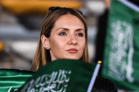 A Saudi Arabian football fan shows support for Saudi Arabia national football team in the 2019 AFC Asian Cup group E football match between Saudi Arabia and Qatar in Abu Dhabi, United Arab Emirates, 17 January 2019. Saudi Arabian football fans cheer for AFC Asian Cup group E match  20190117_10197