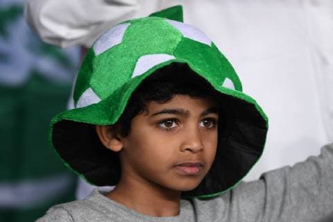 A Saudi Arabian football fan shows support for Saudi Arabia national football team in the 2019 AFC Asian Cup group E football match between Saudi Arabia and Qatar in Abu Dhabi, United Arab Emirates, 17 January 2019. Saudi Arabian football fans cheer for AFC Asian Cup group E match  20190117_72713