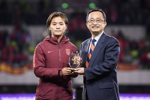 Wang Shuang of Chinese women s national football team, left, earns the MVP Award after defeating South Korea in the final of the CFA Team China International Women s Football Tournament Meizhou Wuhua 2019 in Meizhou city, south China s Guangdong province, 20 January 2018. The Chinese women s national football team lifted the trophy of Meizhou Wuhua International championship after beating South Korea 1-0 in the final here on Sunday.