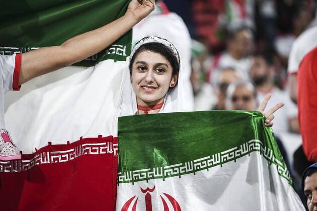 Iran fans wave slogans and national flags to show support to Iran national men s football team in their quarter-final match against China during the 2019 AFC Asian Cup in Abu Dhabi, United Arab Emirates, 24 January 2019. Iran fans cheer for quarter-final match against China  scr161713