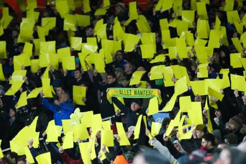 A Cardiff City fan holds up a scarf saying Allez Nantes in memory of Emiliano Sala during the Premier League match at the Emirates Stadium, London. Picture date: 29th January 2019. Picture credit should read: Craig Mercer Sportimage EDITORIAL USE ONLY. No use with unauthorised audio, video, data, fixture lists, club league logos or live services. Online in-match use limited to 120 images, no video emulation. No use in betting, games or single club league player publications. C77R0409.JPG