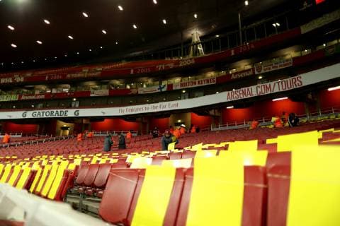 29th January 2019, Emirates Stadium, London, England; EPL Premier League Football, Arsenal versus Cardiff City; Arsenal stewards and Cardiff City staff place yellow cards in the away fans section in memory of Emiliano Sala  ActionPlus12100812 ShaunxBrooks