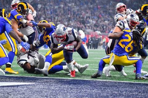 New England Patriots running back Sony Michel (26) charges into the end zone on a two-yard touchdown carry in the fourth quarter of Super Bowl LIII against the Los Angeles Rams at Mercedes-Benz Stadium on February 3, 2019 in Atlanta.  SBP20190203377 KEVINxDIETSCH