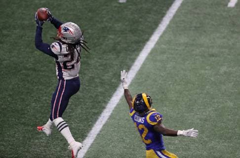 New England Patriots cornerback Stephon Gilmore (24) intercepts a pass intended for Los Angeles Rams wide receiver Brandin Cooks (12) during the second half of Super Bowl LIII at Mercedes-Benz Stadium in Atlanta on February 3, 2019.  SBP201902035109 WILLxNEWTON