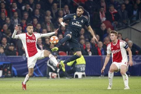 AMSTERDAM, Ajax - Real Madrid, football, Champions League Season 2018 2019, 13-02-2019, Johan Cruijff Arena. Ajax player Noussair Mazraoui (L) and Ajax player Matthijs de Ligt (R) and Real Madrid player Karim Benzema (C) during the game Ajax - Real Madrid. Ajax - Real Madrid  x2820823x