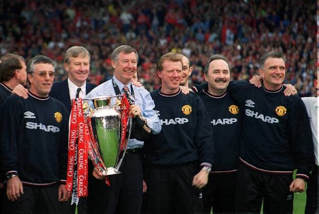 Manager Alex Ferguson Celebrates the Carling Premiership Trophy with his Backroom staff including Eric Harrison - Youth and Reserves teams coach (2nd left) Steve McClaren , United Physio Dave Fevre and Jim Ryan (all on right).. Manchester United ManU Carling Premiership Winners 1998 9. Manchester United v Tottenham Hotspur, 17 05 1999. Football 1998 99 . 