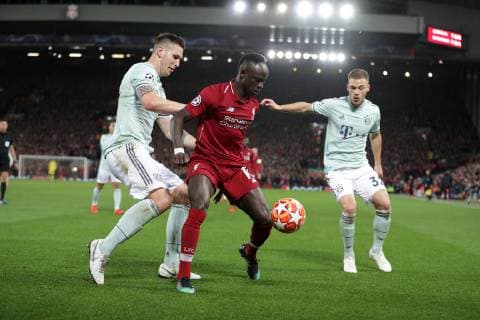 Football - 2018 2019 UEFA Champions League - Round of Sixteen, First Leg: Liverpool vs. Bayern Munich Sadio Mane of Liverpool and Niklas Sule of Bayern Munich at Anfield. COLORSPORT LYNNE CAMERON 